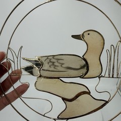 Vintage suncatcher features a mallard duck design outlined in a wire frame