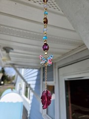 Hanging beaded suncatcher with enamel butterfly charm