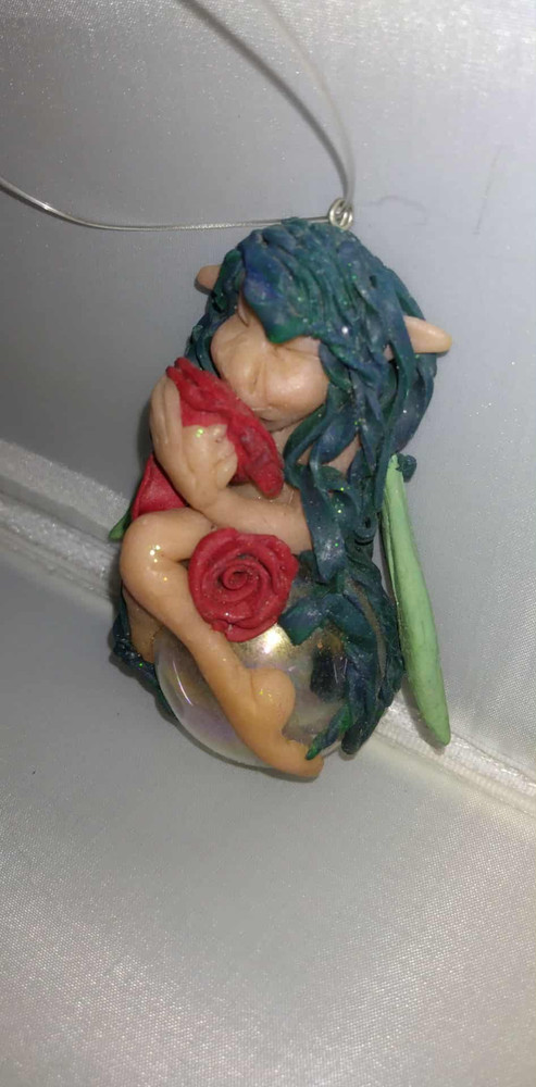 fairy floating on a bubble green with roses handcrafted art