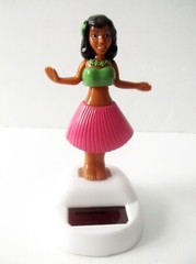 Solar Powered Dancing Hula Girl Bobble Head With Pink Grass Skirt.