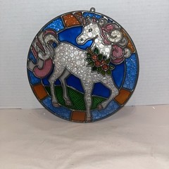 Stained glass suncatcher depicts a white unicorn 8”