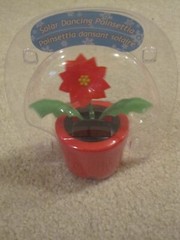 Solar dancing Poinsettia suncatcher new in package Christmas Holiday