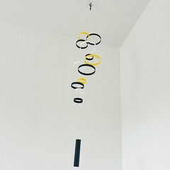 Whirlwind Kinetic Hanging Mobile 12 Rings in Black, Yellow, and White 40×8 inch