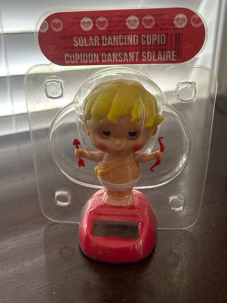 Dancing Cupid Blinking Eyes Dances Under Bright Lights Bobble Solar Powered