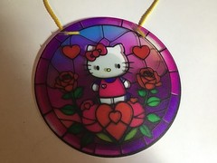 hello kitty suncatcher with stained glass like design. measures 6 inches.