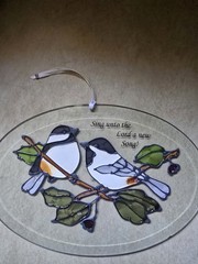 GRAY AND WHITE BIRD OVAL SUNCATCHER 7” SING INTO THE LORD A NEW SONG
