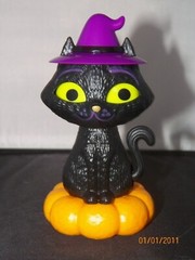 Solar Classic Halloween Black Cat purple witch’s hat sitting on pumpkin seasonal
