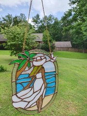 Stained Glass beach girl Suncatcher With Vibrant Colors. Measures 9.5 X 7.5.