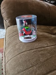 Solar Christmas swinging mouse over Santa’s sleigh with presents snowman penguin