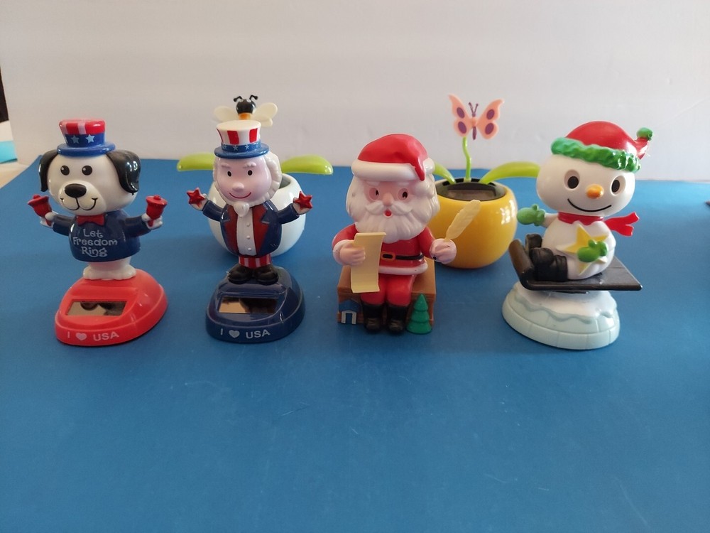 Lot Of 6 Solar Powered Novelty Toys -2 Flowers, Dog, Santa,Uncle Sam & Snowman