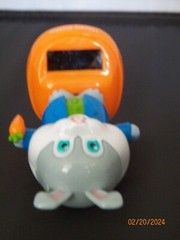 Solar Happy Easter Grey White Rabbit blue coat green button shirt orange carrot